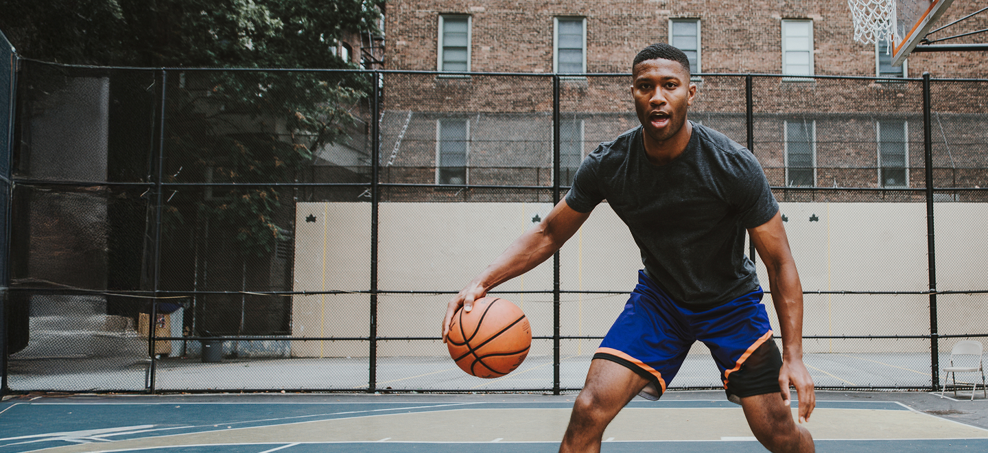 Person playing basketball.